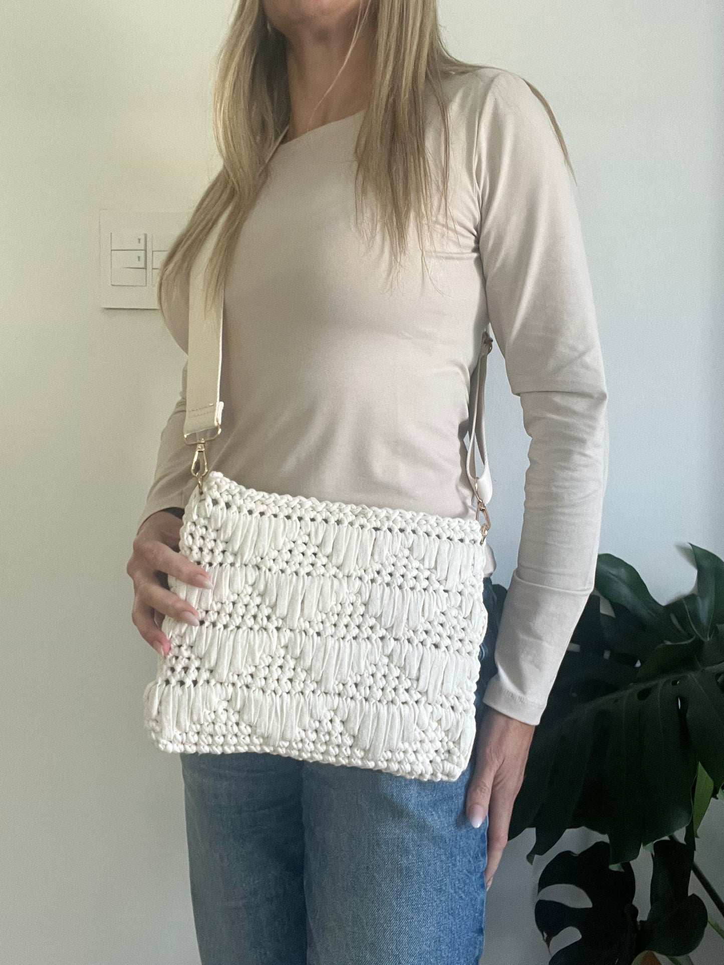 Textured Cream Clutch Bag with attachable Crossbody Strap, to keep your essentials close while leaving your hands free for life’s adventures.