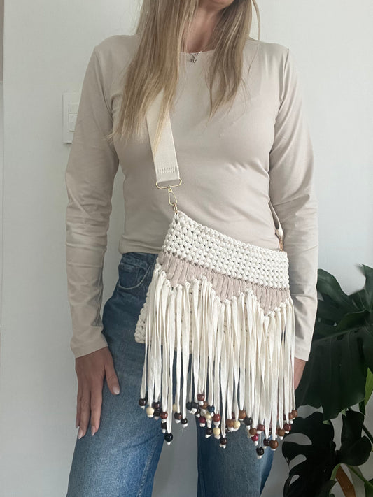 Cream and Beige Clutch with tassles and beads. This fun Crossbody Strap Bag keeps your essentials close while leaving your hands free to make a statement.