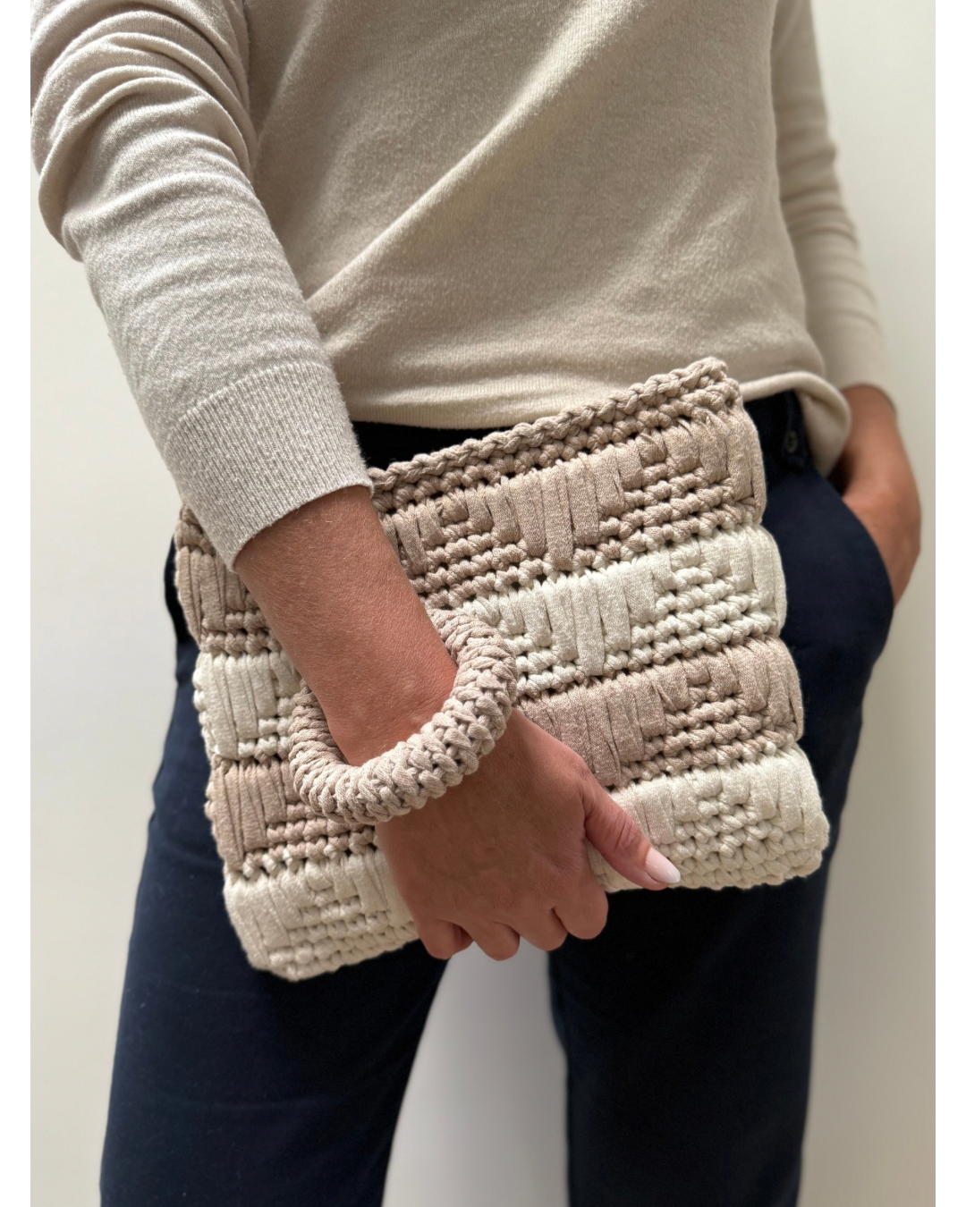 The soft neutral palette complements every outfit, while the sustainable materials ensures conscious style. Includes a crochet bangle for a hands-free hold.
